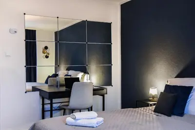 Ein Bett oder Betten in einem Zimmer der Unterkunft Deluxe! Hbf-Nähe mit Kingsize-Bett, 65 m2