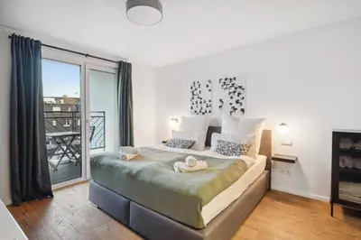 Ein Bett oder Betten in einem Zimmer der Unterkunft Design-Apartment - Bochum Zentrum - 2 Balkons - 118m2 - Netflix