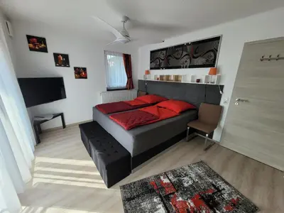 Ein Bett oder Betten in einem Zimmer der Unterkunft Penthouse-Apartment AM KORNFELD