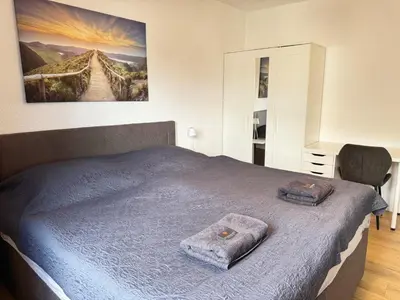 Ein Bett oder Betten in einem Zimmer der Unterkunft 3 Zimmer Apartment mit Garten