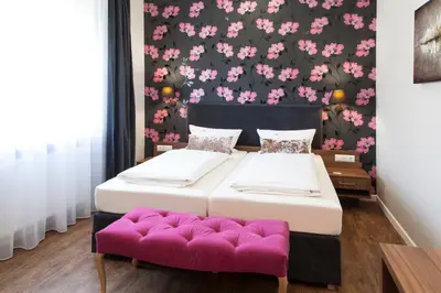 Ein Bett oder Betten in einem Zimmer der Unterkunft Hotel Engelbert