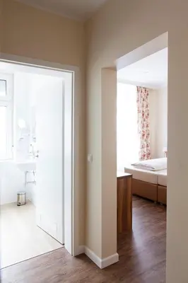 Ein Bett oder Betten in einem Zimmer der Unterkunft Hotel Engelbert