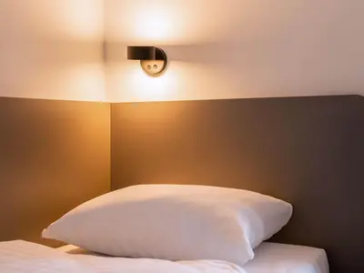 Ein Bett oder Betten in einem Zimmer der Unterkunft B&B Hotel Hamm