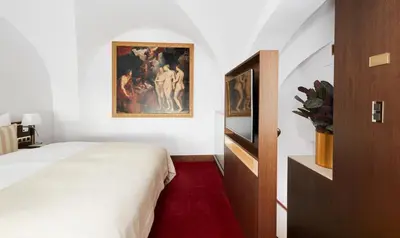 Ein Bett oder Betten in einem Zimmer der Unterkunft Living Hotel De Medici