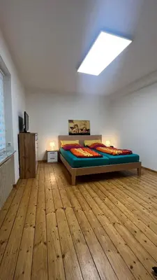 Ein Bett oder Betten in einem Zimmer der Unterkunft Erdgeschoss Apartment am Park im Theaterviertel in Oberhausen