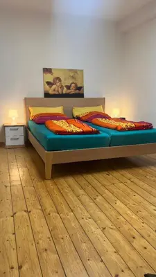 Ein Bett oder Betten in einem Zimmer der Unterkunft Erdgeschoss Apartment am Park im Theaterviertel in Oberhausen