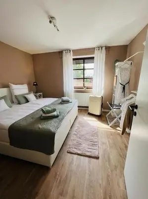 Ein Bett oder Betten in einem Zimmer der Unterkunft Das Bergherz Ruhe + Natur pur