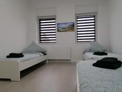 Ein Bett oder Betten in einem Zimmer der Unterkunft estrella24 LIVING ROOMS Zermatt