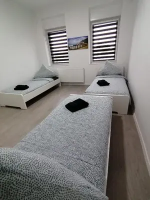 Ein Bett oder Betten in einem Zimmer der Unterkunft estrella24 LIVING ROOMS Zermatt