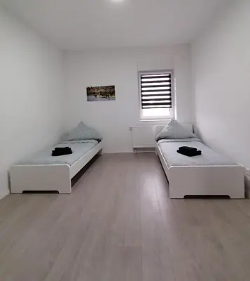 Ein Bett oder Betten in einem Zimmer der Unterkunft estrella24 LIVING ROOMS Namibia