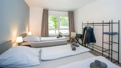 Ein Bett oder Betten in einem Zimmer der Unterkunft ERSTAY - bis zu 5 Personen I Balkon