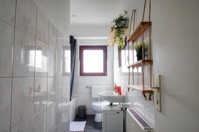 Ein Badezimmer in der Unterkunft HOMEFY - Family Apartment
