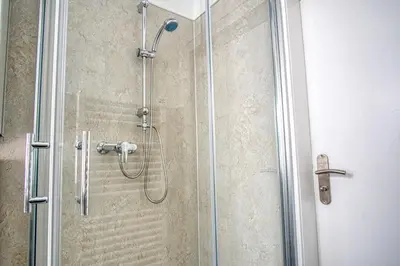 Ein Badezimmer in der Unterkunft HOMEFY - Sleep & Relax Apartment