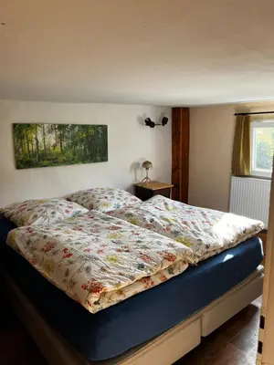 Ein Bett oder Betten in einem Zimmer der Unterkunft Wohnen auf dem Bauernhof