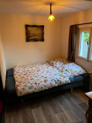 Ein Bett oder Betten in einem Zimmer der Unterkunft Wohnen auf dem Bauernhof