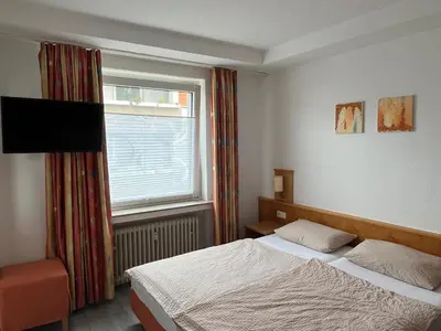 Ein Bett oder Betten in einem Zimmer der Unterkunft Brauhaus Hotel Ruetershoff