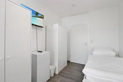 Ein Bett oder Betten in einem Zimmer der Unterkunft Wuppertal Stay- Fitter Apartment