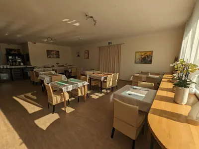 Ein Sitzbereich in der Unterkunft Hotel Gästehaus Altena