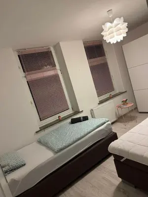 Ein Bett oder Betten in einem Zimmer der Unterkunft New York by D&J Apartments Altenessen Nord