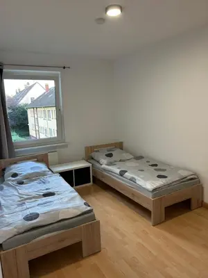 Ein Bett oder Betten in einem Zimmer der Unterkunft Prima Service Appartement ,Ferienwohnung ,Apartment AVD4