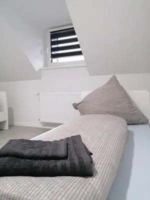 Ein Bett oder Betten in einem Zimmer der Unterkunft estrella24 LIVING ROOMS Chita