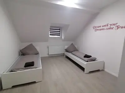 Ein Bett oder Betten in einem Zimmer der Unterkunft estrella24 LIVING ROOMS Chita