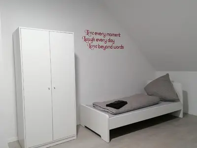 Ein Bett oder Betten in einem Zimmer der Unterkunft estrella24 LIVING ROOMS Chita