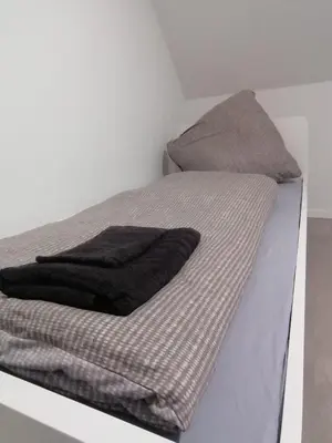Ein Bett oder Betten in einem Zimmer der Unterkunft estrella24 LIVING ROOMS Chita