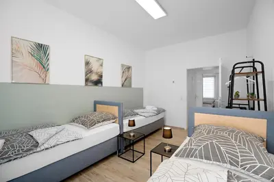 Ein Bett oder Betten in einem Zimmer der Unterkunft Rudi Homes Essen #1