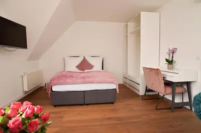 Ein Bett oder Betten in einem Zimmer der Unterkunft Victoria Altstadt Boardinghouse
