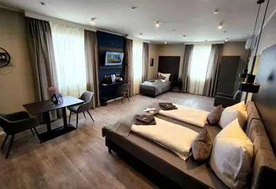 Ein Bett oder Betten in einem Zimmer der Unterkunft Liro Hotel Oberhausen