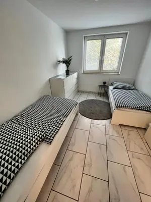 Ein Bett oder Betten in einem Zimmer der Unterkunft 1-6 Pers DesignWohnung in zentraler Lage Wtal und Remscheid