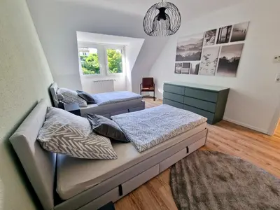 Ein Bett oder Betten in einem Zimmer der Unterkunft Bis 4 Pers. 0,3 km zur City von Wuppertal – neuwertige Wohnung
