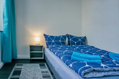 Ein Bett oder Betten in einem Zimmer der Unterkunft BIG Apartment bis 7 Personen