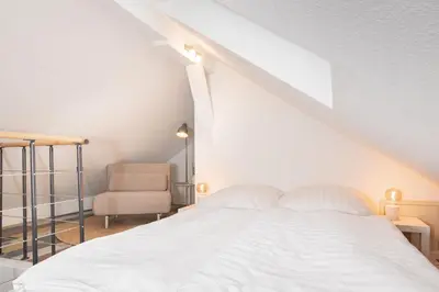 Ein Bett oder Betten in einem Zimmer der Unterkunft Mc‘Maggies Atelier