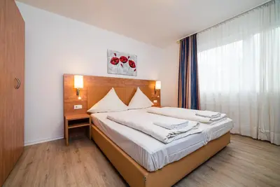 Ein Bett oder Betten in einem Zimmer der Unterkunft G & L Hotel Dortmund