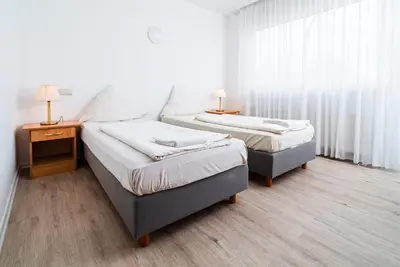 Ein Bett oder Betten in einem Zimmer der Unterkunft G & L Hotel Dortmund