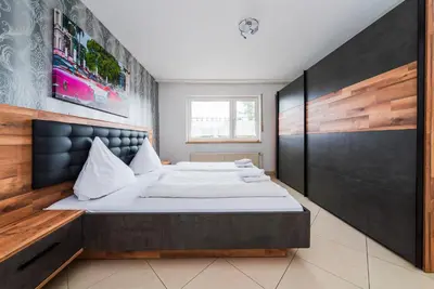 Ein Bett oder Betten in einem Zimmer der Unterkunft G & L Hotel Dortmund