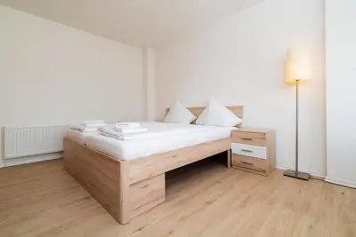 Ein Bett oder Betten in einem Zimmer der Unterkunft G & L Hotel Dortmund