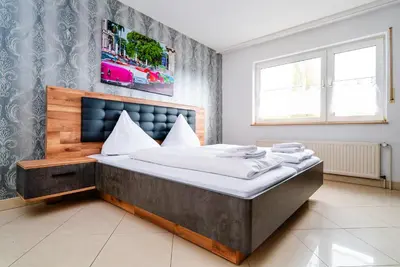 Ein Bett oder Betten in einem Zimmer der Unterkunft G & L Hotel Dortmund