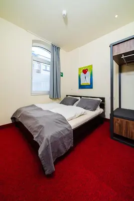 Ein Bett oder Betten in einem Zimmer der Unterkunft Reinoldus Hotel Dortmund