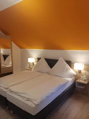 Ein Bett oder Betten in einem Zimmer der Unterkunft Becky´s Kolpinghaus