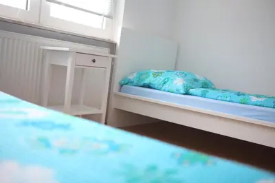 Ein Bett oder Betten in einem Zimmer der Unterkunft White House Bochum Ehrenfeld