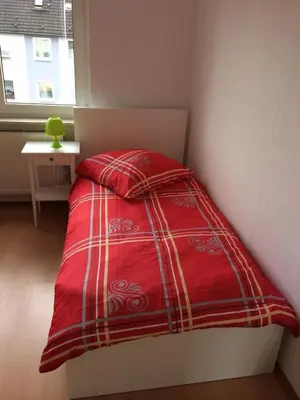 Ein Bett oder Betten in einem Zimmer der Unterkunft White House Bochum Ehrenfeld