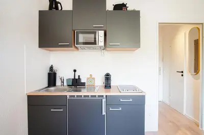 Küche/Küchenzeile in der Unterkunft HOMEFY - Boho Studio