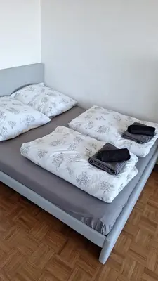 Ein Bett oder Betten in einem Zimmer der Unterkunft Business Messe Apartment & Wellness Spa