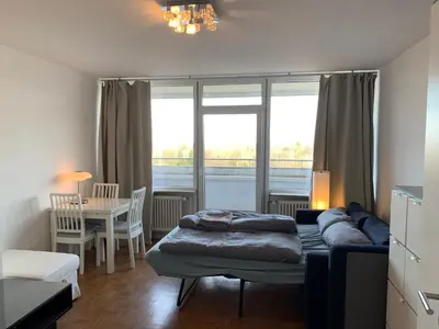 Ein Bett oder Betten in einem Zimmer der Unterkunft Business Messe Apartment & Wellness Spa