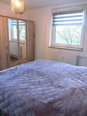 Ein Bett oder Betten in einem Zimmer der Unterkunft City Apartment 2#Netflix &Wlan &Kingsize Bett & Kaffee Maschine & Zentral & 500m Innenhafen & 2 min U Bahn