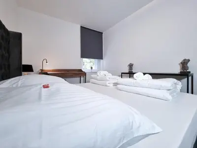 Ein Bett oder Betten in einem Zimmer der Unterkunft Alpha Apartments