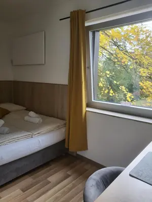 Ein Bett oder Betten in einem Zimmer der Unterkunft Hotel Mettmann